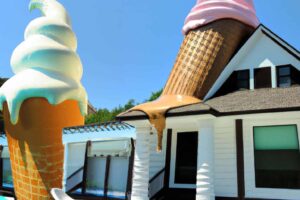 giant ice cream cone melting on to a modern house